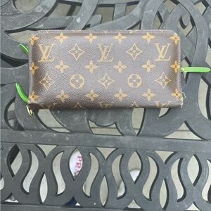 Louis Vuitton Monogrammed Insolite Wallet with apple green interior.